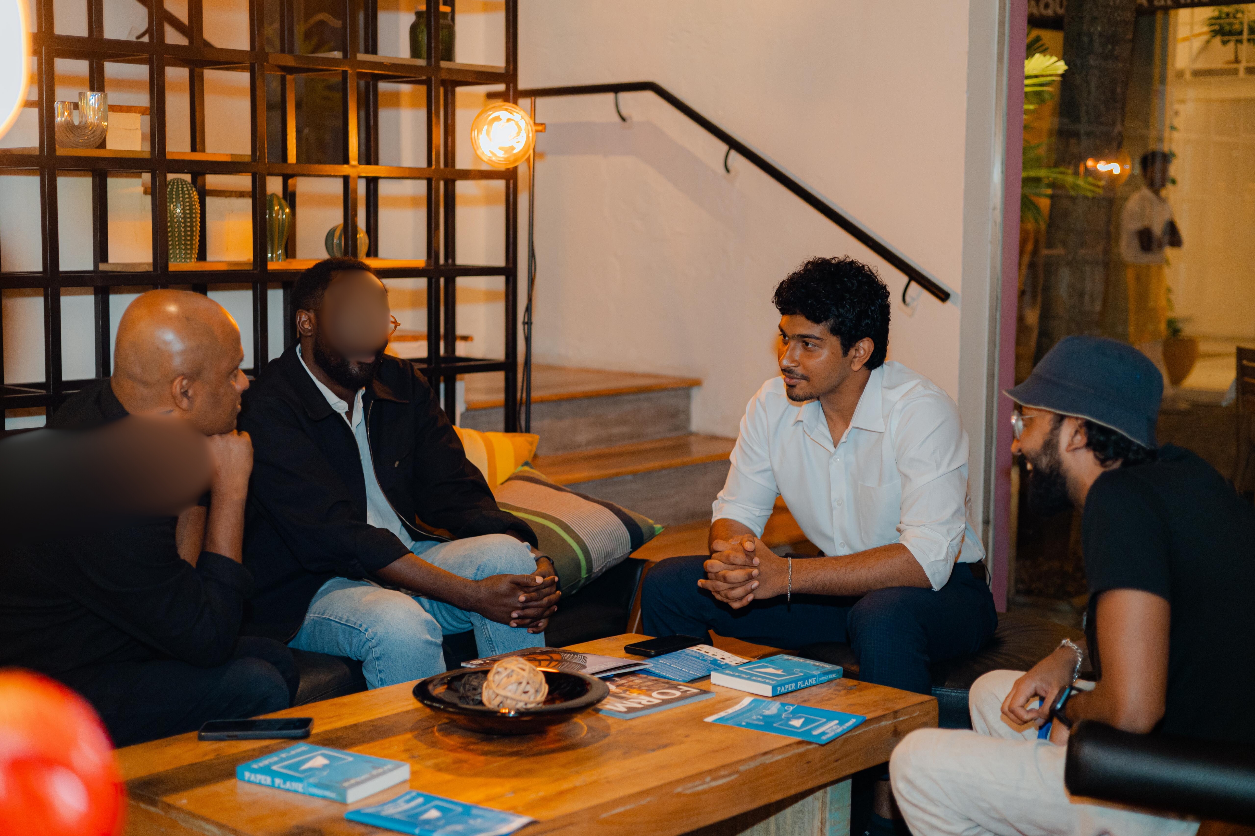 Dineth in discussion with a group